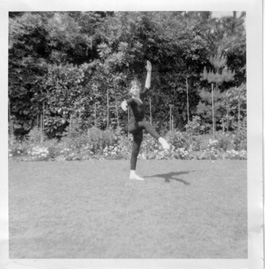 black & white photo of sonia as a child doing ballet in the garden
